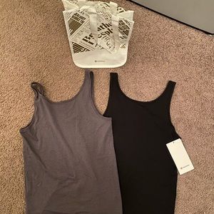 2 lululemon tank tops- never worn! Bag included.